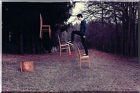 Man walks on floating chairs