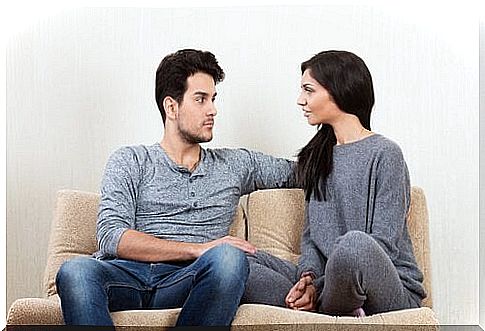 Couple in sofa trying to avoid quarrel