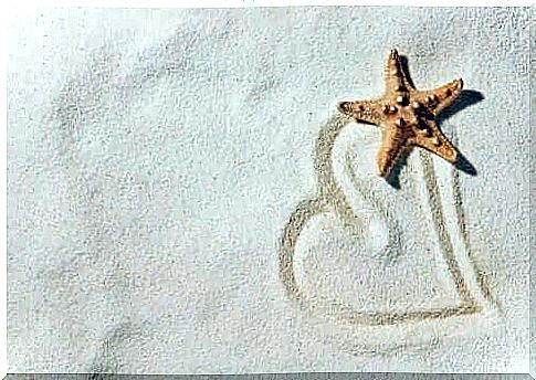 heart drawn in sand