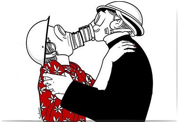 Couple kissing with gas masks on as they are in a toxic relationship