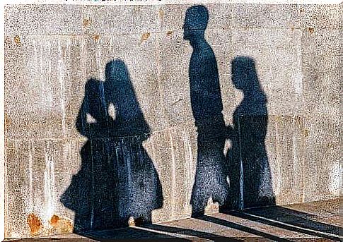 Shadow of people walking in pairs