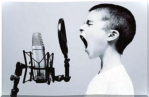 Boy shouting into a microphone