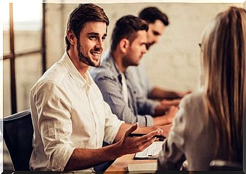 Man smiling and speaking: His tone conveys confidence