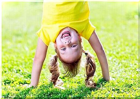 A girl stands on hands