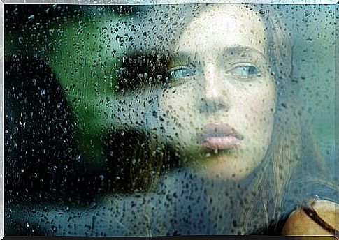 sad woman looking out window.  To value life