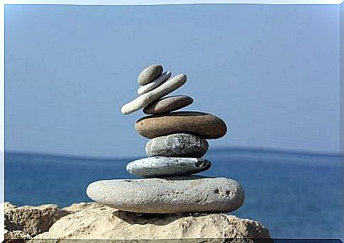 Pile of rocks balancing in front of sea