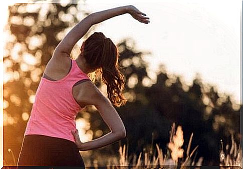 Woman exercises as physical exercise makes us happier