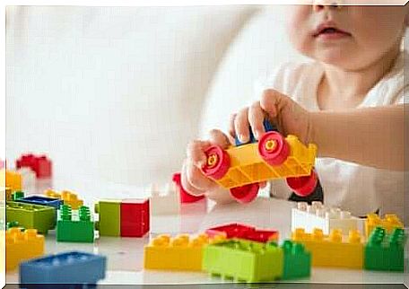 Child playing with building blocks