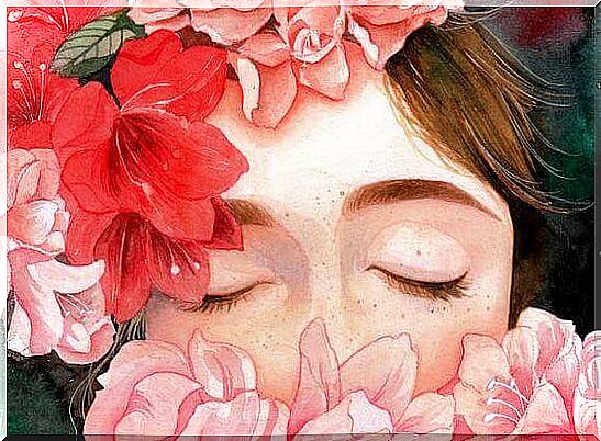 Woman with closed eyes and flowers around her