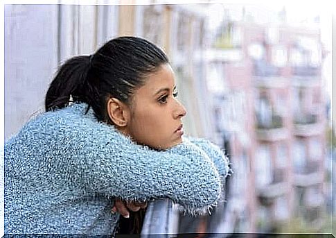 Woman on balcony thinking about quotes by Octavio Paz