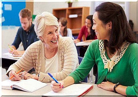 Women take notes in classroom