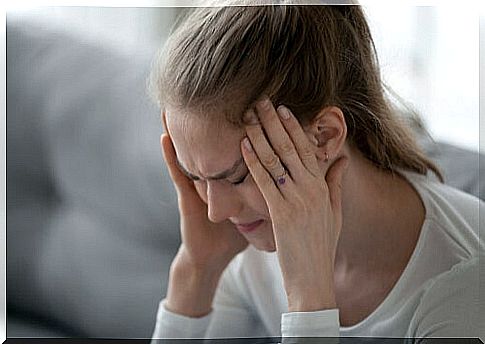 woman with headache has difficulty dealing with physical pain