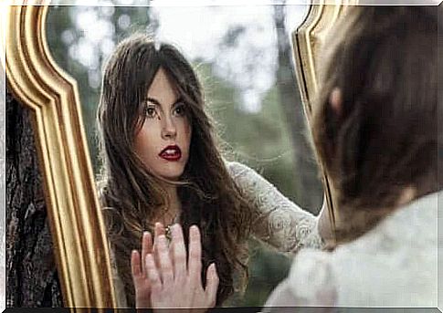 Woman looking in mirror