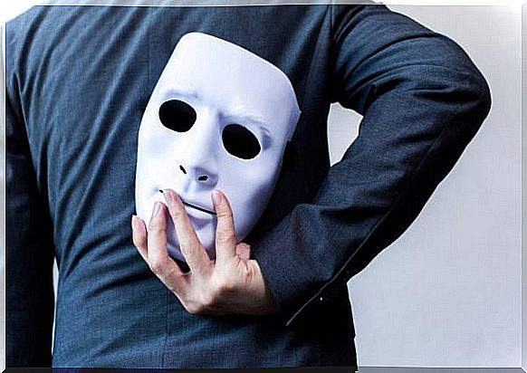 Man with mask behind back