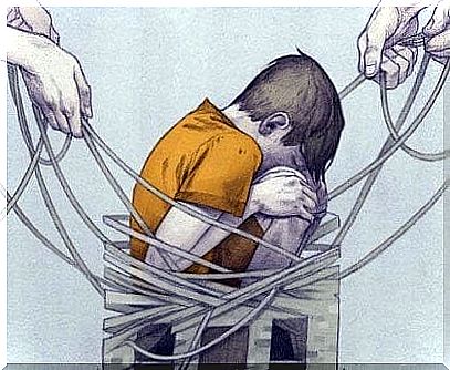 Boy sits tied by strings as a symbol of the consequences of bullying