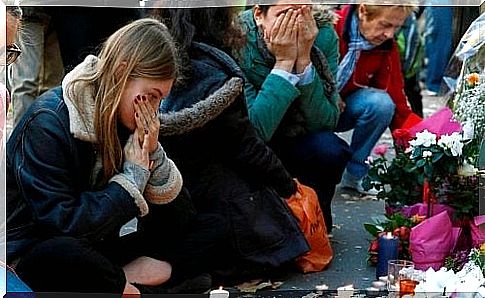 People mourn at the memorial to terrorism