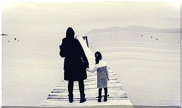 mother and daughter on bridge