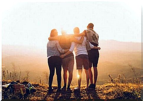 Group of friends standing together in nature