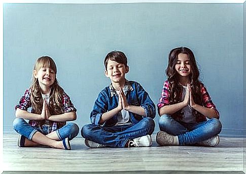 Children meditate to achieve peace