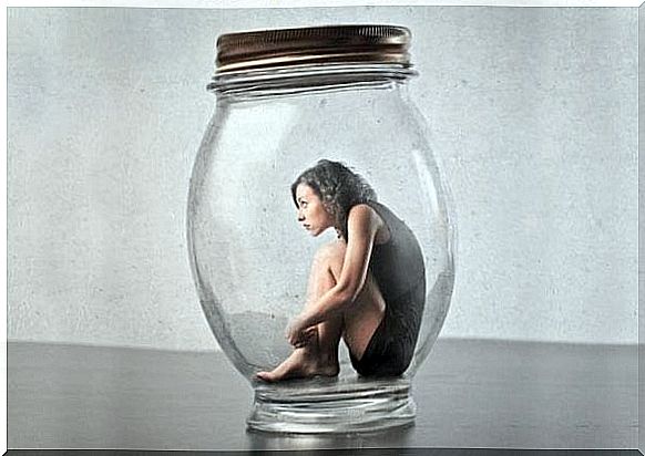 Alone time can help you understand your fears, just like this woman in glass