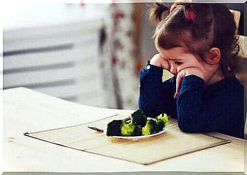 Little girl will not eat broccoli