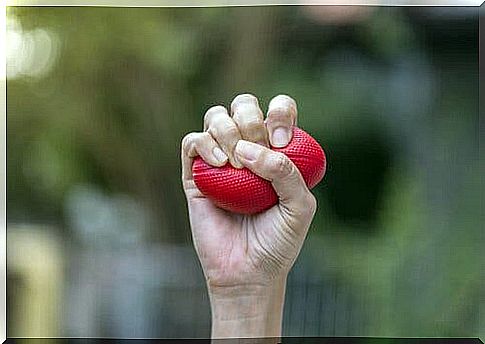 Man squeezing stress ball