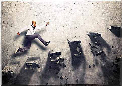 A highly motivated man walks up some crumbling steps